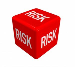 Image of red die representing risks in project management.